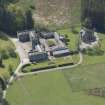Oblique aerial view of Cluny Castle stable blocks, looking to the WSW.