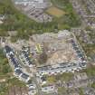 General oblique aerial view of the construction site of Oakhill Grange Housing Estate on the site of the former Oakbank Approved School, looking to the N.