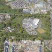 General oblique aerial view of the construction site of Oakhill Grange Housing Estate on the site of the former Oakbank Approved School, looking to the N.