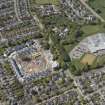 General oblique aerial view of the construction site of Oakhill Grange Housing Estate on the site of the former Oakbank Approved School with Beechwood School adjacent, looking to the NW.