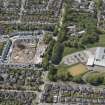 General oblique aerial view of the construction site of Oakhill Grange Housing Estate on the site of the former Oakbank Approved School with Beechwood School adjacent, looking to the W.