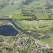 General oblique aerial view of the Aspire Golf Centre with adjacent Inchgarth Reservoir, looking to the S.