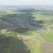 Oblique aerial view of Kemnay, looking to the E.