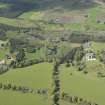 General oblique aerial view of Cluny Castle estate centred on Cluny Castle, looking to the NNW.