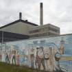 Detail of mural wall and chimneys.