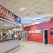 Interior. View of reception desk and concourse into centre