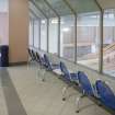 Interior. View from West of long central corridor, showing spectators area for swimming pool.