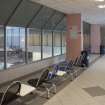 Interior. View from East of long central corridor, showing spectators area for swimming pool