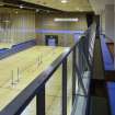 Interior. Oblique view looking down into the main sports hall, including the viewing balcony within the central corridor.