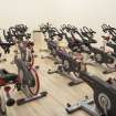 Interior. View of "spin'' class bikes within former squash court.