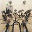 Interior. View of "spin'' class bikes within former squash court.