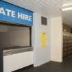 Interior. Detail of Skate hire station and lockers within ice rink.