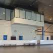 Interior. View looking up to cantilevered dance studio from ice rink.