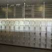 Interior. Detail of lockers and Curling sessions board within the ice rink.