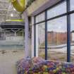 Interior. View looking east within the extension to the swimming pool hall, with windows to the unused exterior pool.