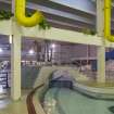 Interior. View looking north from the pool extension, through the structure of the former back wall of the swimming pool hall.