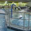 Interior. View looking south along the swimming pool hall, with the pool extension beyond.