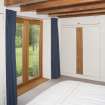 General view of master bedroom showing french doors to the garden.