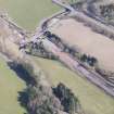 Oblique aerial view of Fountainhall showing construction of the Borders Railway Line, looking N.