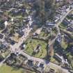 Oblique aerial view of Stow centred on Old Stow Kirk, looking ENE.