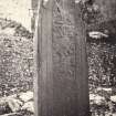 View of face of carved stone cross shaft fragment, supposodly stands at a saints grave in St. Cormac's Chapel ruins, Eilean Mor, Argyll and Bute.
Titled: '135. At Ealan Mor.'
PHOTOGRAPH ALBUM NO 186: J B MACKENZIE ALBUMS vol.1