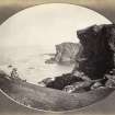 View of figure seated on embankment facing the rock formations at Uragaig beach, Colonsay. Vignetted Image.
Titled: '147. At Urgaig. Colonsay.'
PHOTOGRAPH ALBUM NO 186: J B MACKENZIE ALBUMS vol.1