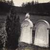 View of two 19th century grave slabs in the graveyard of Kilchrenan Parish Church, Kilchrenan and Dalavich, Argyll. On the left, the memorial to Margaret Crawford Mackenzie (d1861), erected by her husband John Williams; on the right the memorial to Elizabeth nee Crawford (d1864), wife of Rev. Neil Mackenzie, the incumbent at Kilchrenan, but particularly well known for hs ministry of St Kilda from 1830-1844. Margaret was presumably the daughter of Neil and Elizabeth. 
Titled: '152. at Kilchrenan.'
PHOTOGRAPH ALBUM NO 186: J B MACKENZIE ALBUMS vol.1