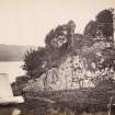 View of the ruins of the late medieval Finchard Castle with moored boat in the foreground, situated on the promontory near the south end of Loch Awe with the view of its eastern shore in the foreground, Lochawe, Kilmichael Glassary.
Titled: '166. Fincharn Castle, Lochawe.'
PHOTOGRAPH ALBUM NO 186: J B MACKENZIE ALBUMS vol.1