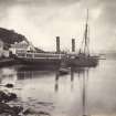 Wide view of steamship known as 'Chavalier' moored at Crinan Harbour, Crinan Loch, North Knapdale.
Titled: '42. "Chevalier" at Crinan.'
PHOTOGRAPH ALBUM, NO 186: J B MACKENZIE ALBUMS vol.1