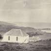 View of Colonsay and Oronsay Parish Church, formerly also the schoolhouse, at Scalasaig, Colonsay.
Titled: '101. Colonsay church and schoolhouse.'
PHOTOGRAPH ALBUM NO 186: J B MACKENZIE ALBUMS vol.1