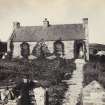 View of front of Sgreadan Cottage, including various figures and a horse on Colonsay, Argyll.
Titled: 'Sgreadan Cottage, Colonsay'.
PHOTOGRAPH ALBUM No. 187, (cf PAs 186 and 188) Rev. J.B. MacKenzie of Colonsay Albums,1870, vol.2.
