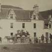 View of various figures surrounding a horse-drawn coach, supposodly from 'Ardrishaig, all situated outside Kilmartin Inn, now known as 'Kilmartin Hotel', Kilmartin, Argyll. 
PHOTOGRAPH ALBUM No. 187, (cf PAs 186 and 188) Rev. J.B. MacKenzie of Colonsay Albums,1870, vol.2.
