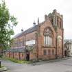 General view of hall and adjacent church from North East.