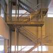 Interior. View of stairwell leading up from poolside to flumes.