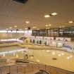 Interior. View looking across the main pool hall from upper level of flume access stair.