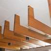Interior. Ground floor. Detail of wooden trusses and lights in entrance hall.