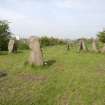 View looking west to the centre stone of the Sighthill Stone Circle, with the 3 stones of the south west grouping to left and the 5 stones of the north west grouping to the right
