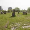 View looking east to the centre stone of the Sighthill Stone Circle, with the 3 stones of the north east grouping to left and the 5 stones of the south east grouping to the right.