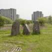View looking north east from the centre of the Sighthill Stone Circle towards the north east stone grouping, with the Pinkston Drive high rise flats beyond