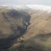 General oblique aerial view of Alva Glen with Bengengie Hill beyond, looking NNW.