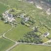 Oblique aerial view of Kildonan village and Kildonan Castle, looking to the SE.