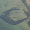 Oblique aerial view of the remains of the harbour, looking to the WSW.