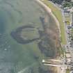 Oblique aerial view of the remains of the harbour and pier, looking to the SSW.