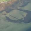 Oblique aerial view of the remains of the harbour, looking to the N.