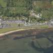 General oblique aerial view of the Hamilton Terrace area of Lamlash and the remains of the harbour, looking to the NW.