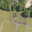 Oblique aerial view of Kilbride Chapel and churchyard, looking to the E.