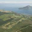 General oblique aerial view of Lamlash Bay with Lamlash Golf Course in the foreground and Holy Island in the bay, looking to the E.