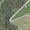 Oblique aerial view of the tank firing track at Little Balmae centred on the blast wall, looking NE.