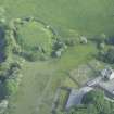 Oblique aerial view of Buittle Castle and Buittle Place Tower House, looking to the SSE.