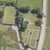 Oblique aerial view of St Andrew's Church and graveyard, looking to the S.
